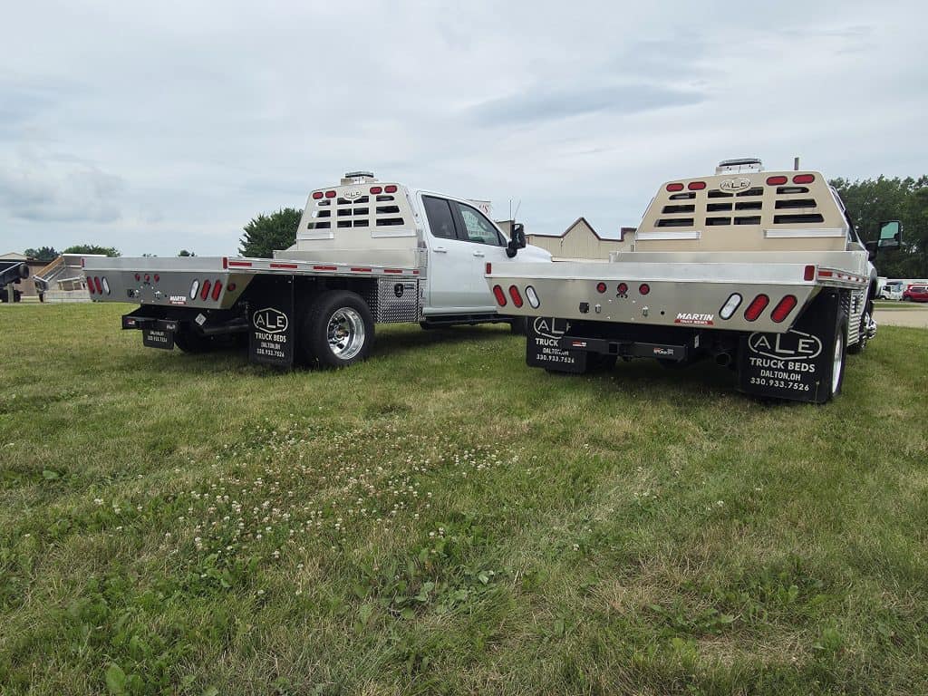 New delivery trucks for a local Bobcat dealer with aluminum flatbeds installed by truck bed installers Ohio